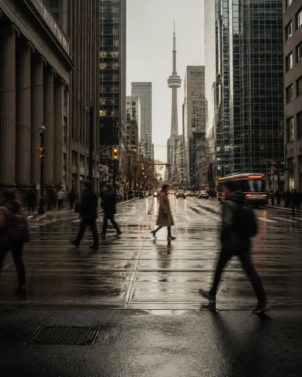 Traffic moving along a Toronto arterial road at dusk